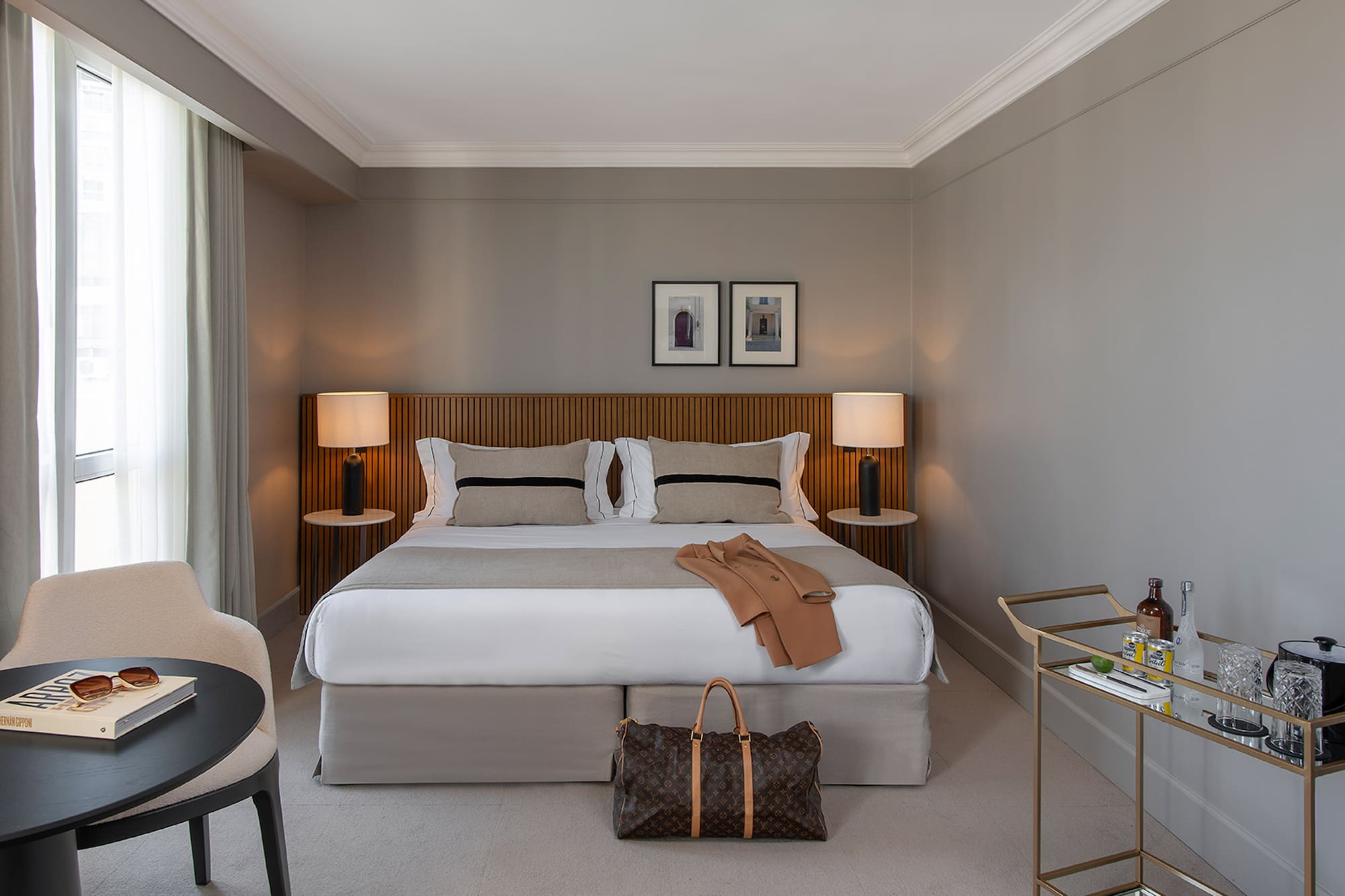 a bedroom with a bed and a table