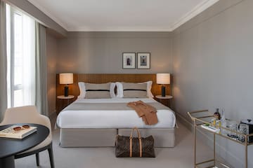 a bedroom with a bed and a table