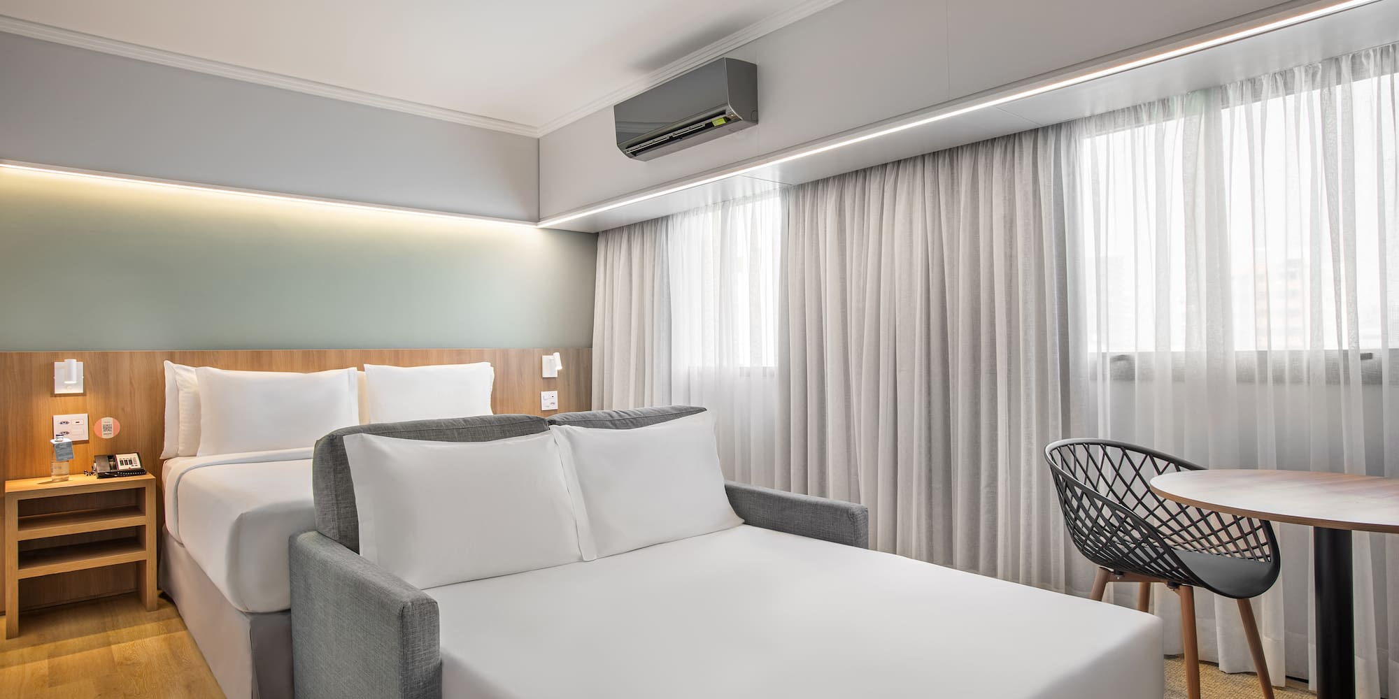 a room with a bed and a chair