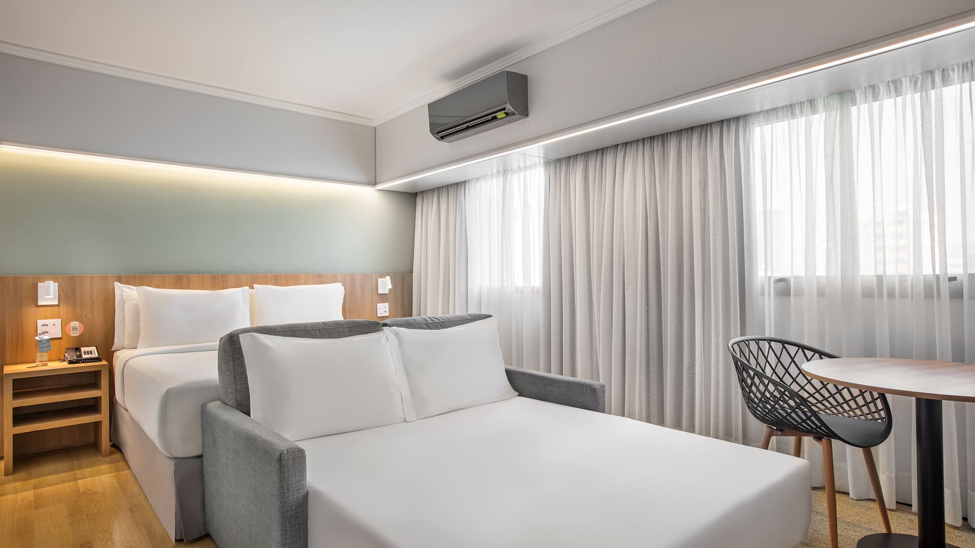 a room with a bed and a chair