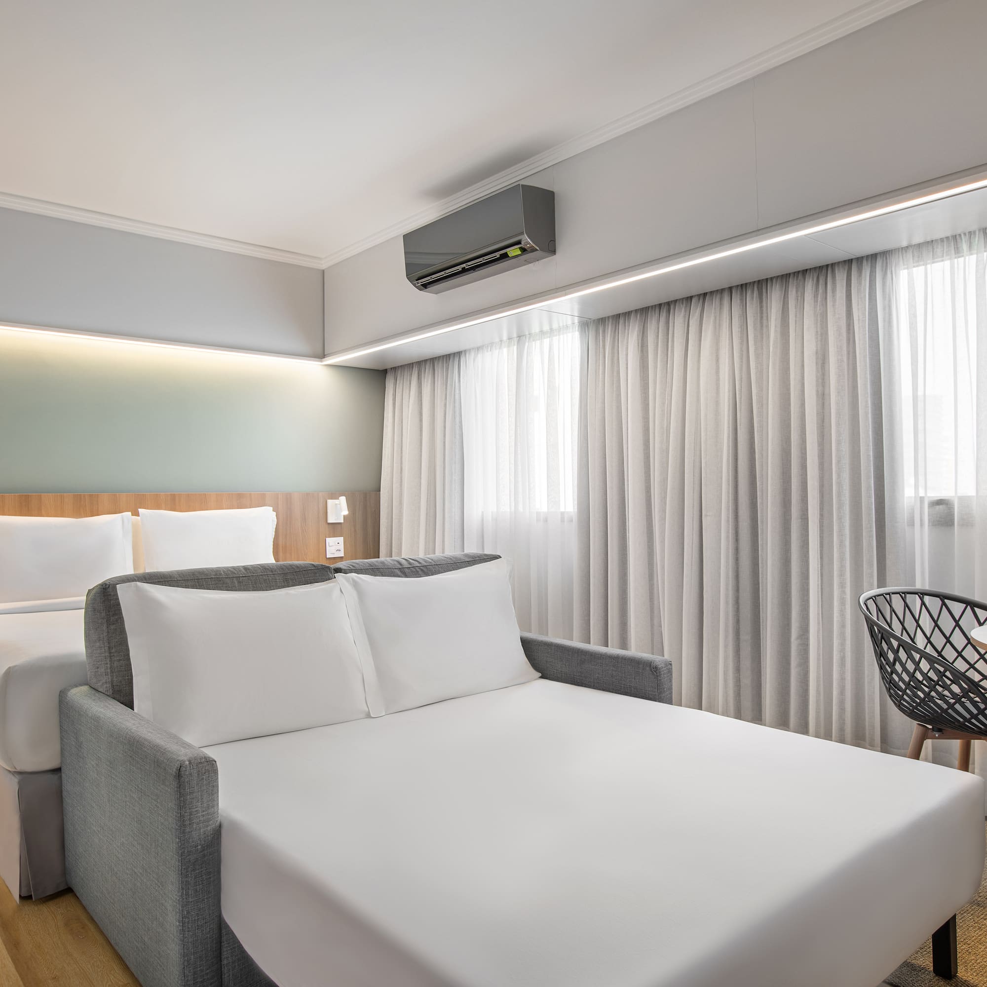 a room with a bed and a chair