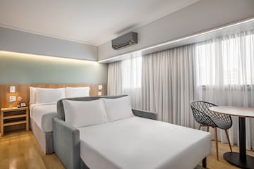 a room with a bed and a chair
