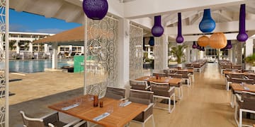 a restaurant with tables and chairs