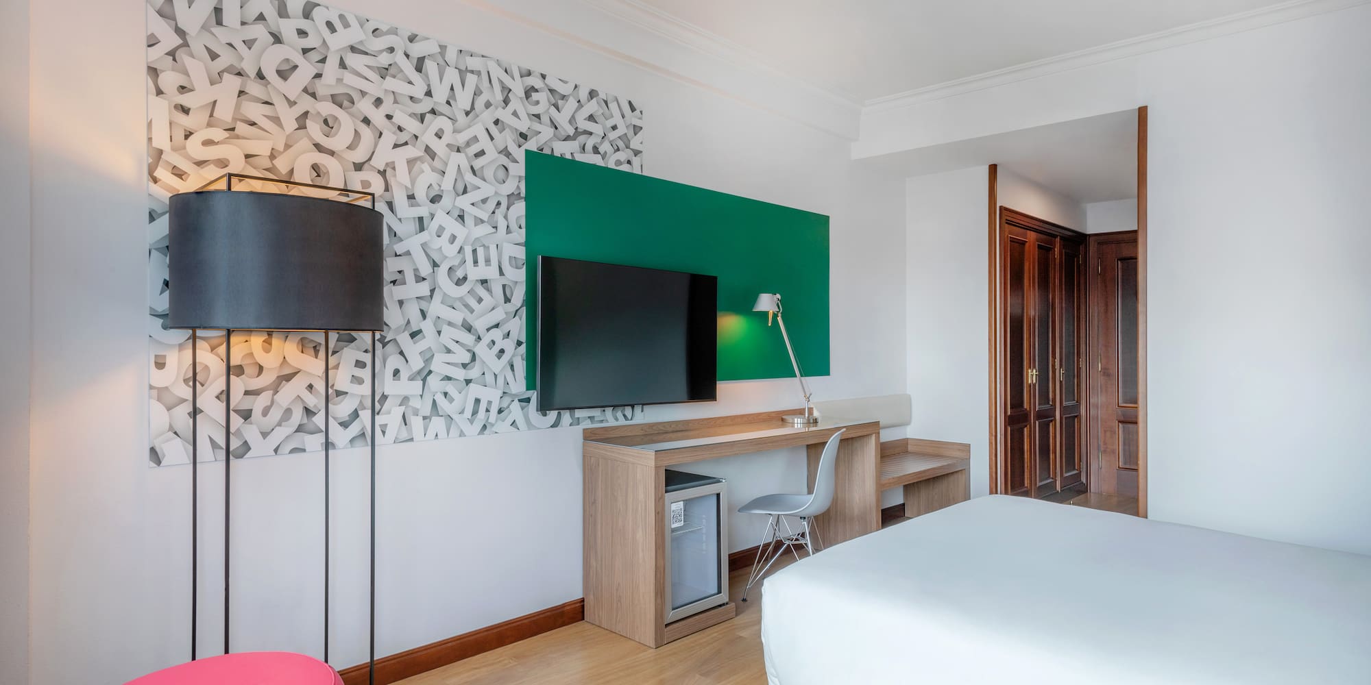 a room with a bed and a tv