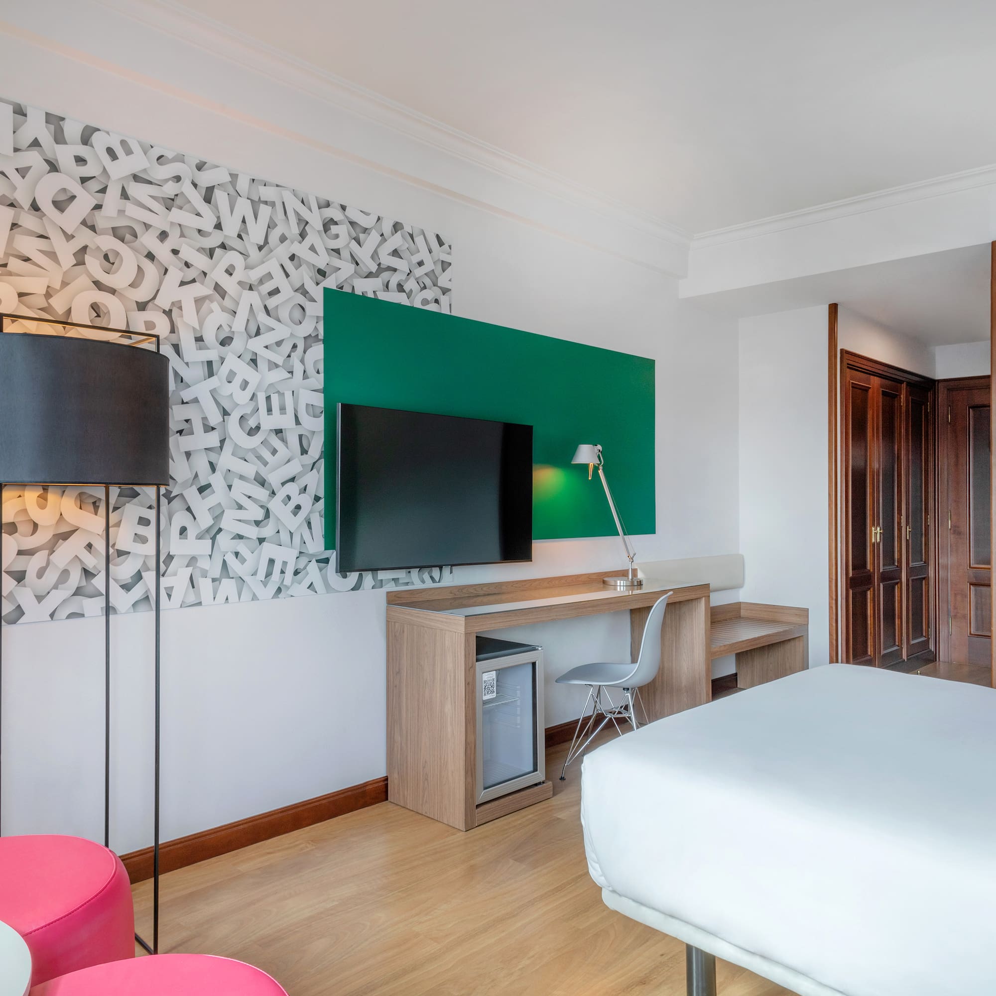 a room with a bed and a tv