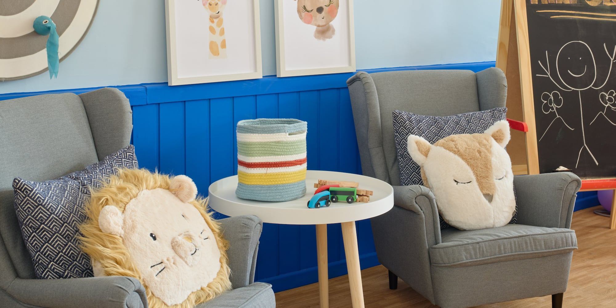 a room with chairs and pictures on the wall