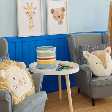 a room with chairs and pictures on the wall