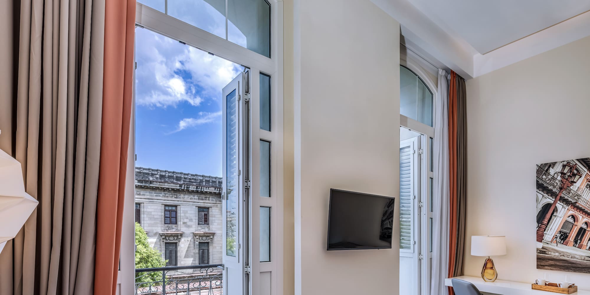 a room with a bed and a tv