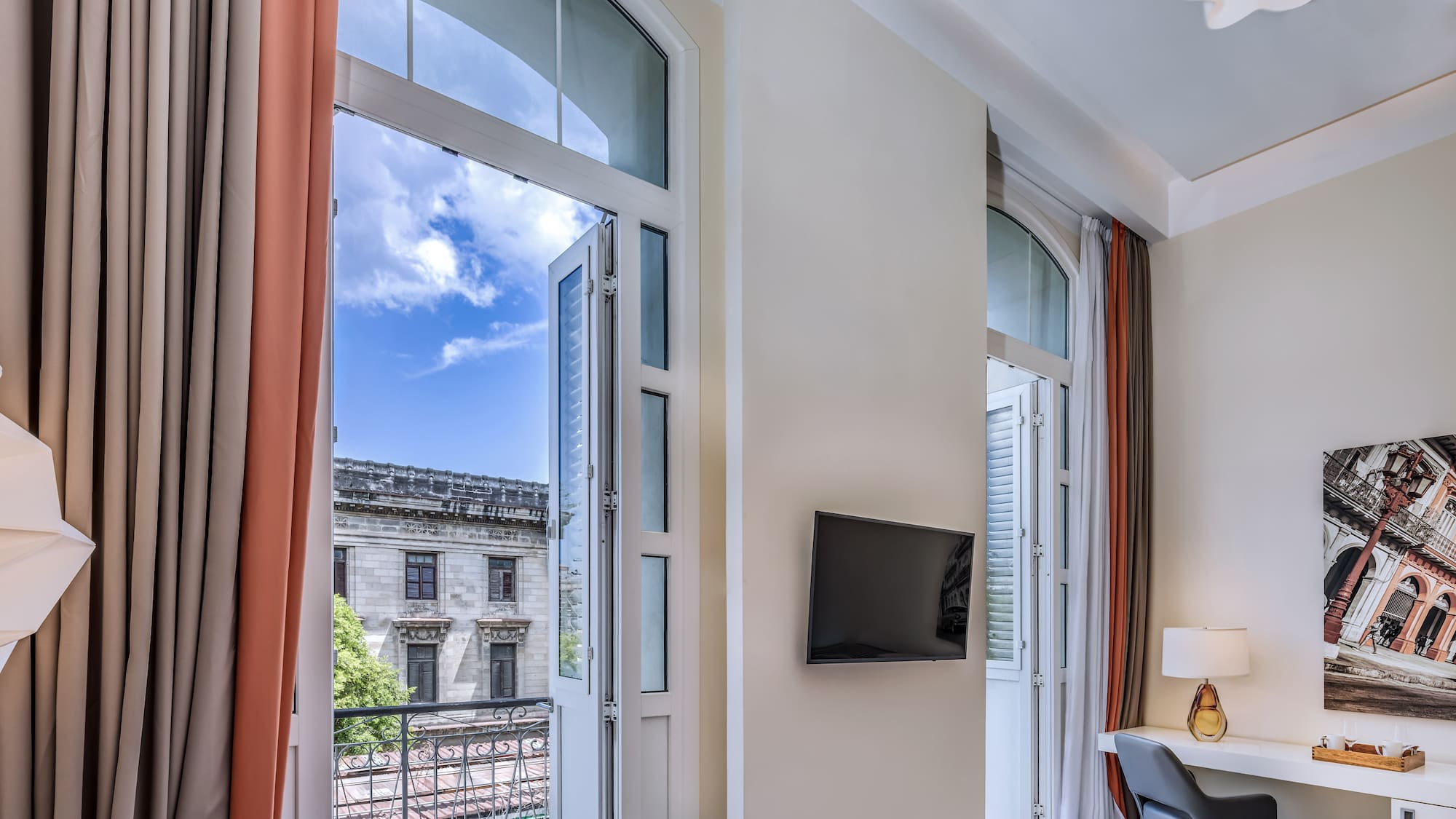 a room with a bed and a tv