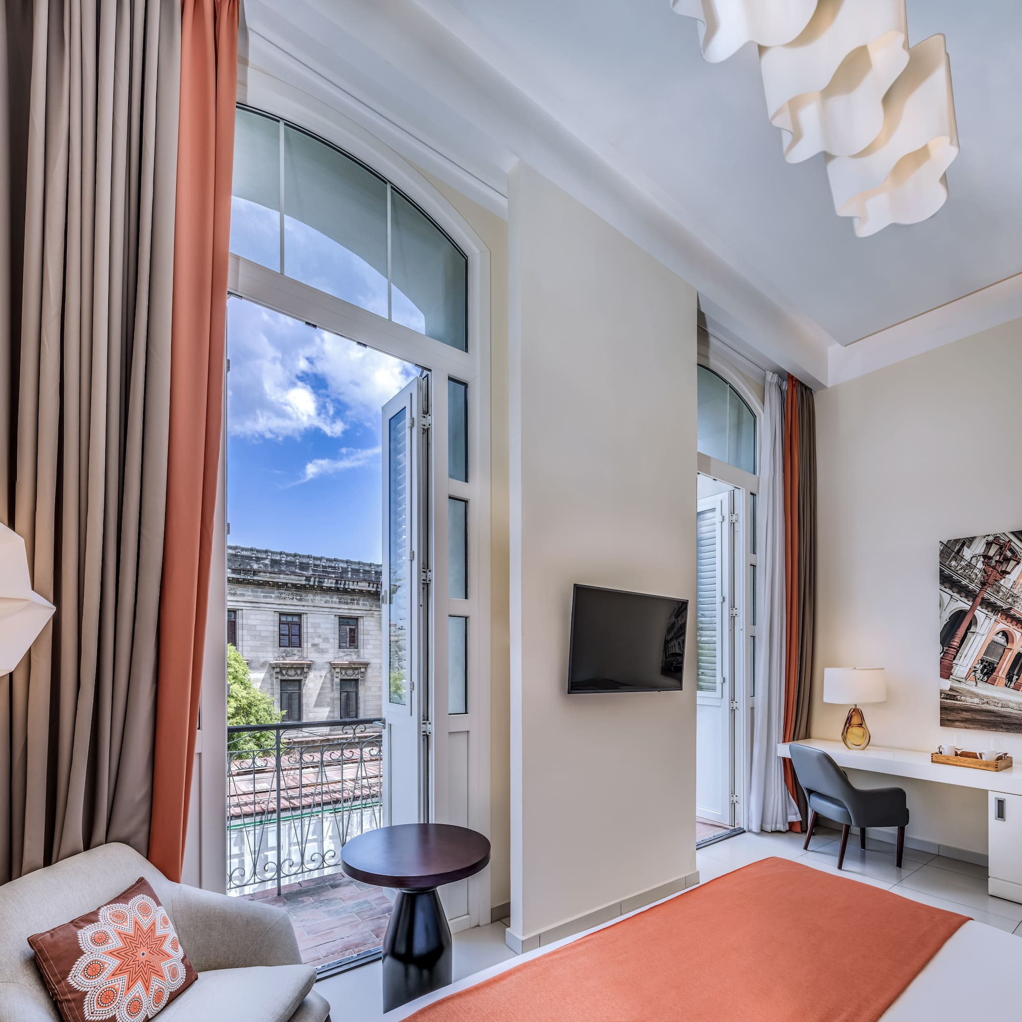 a room with a bed and a tv