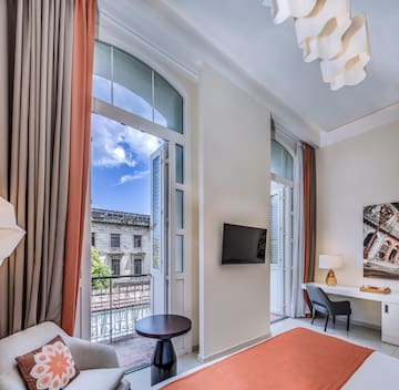 a room with a bed and a tv