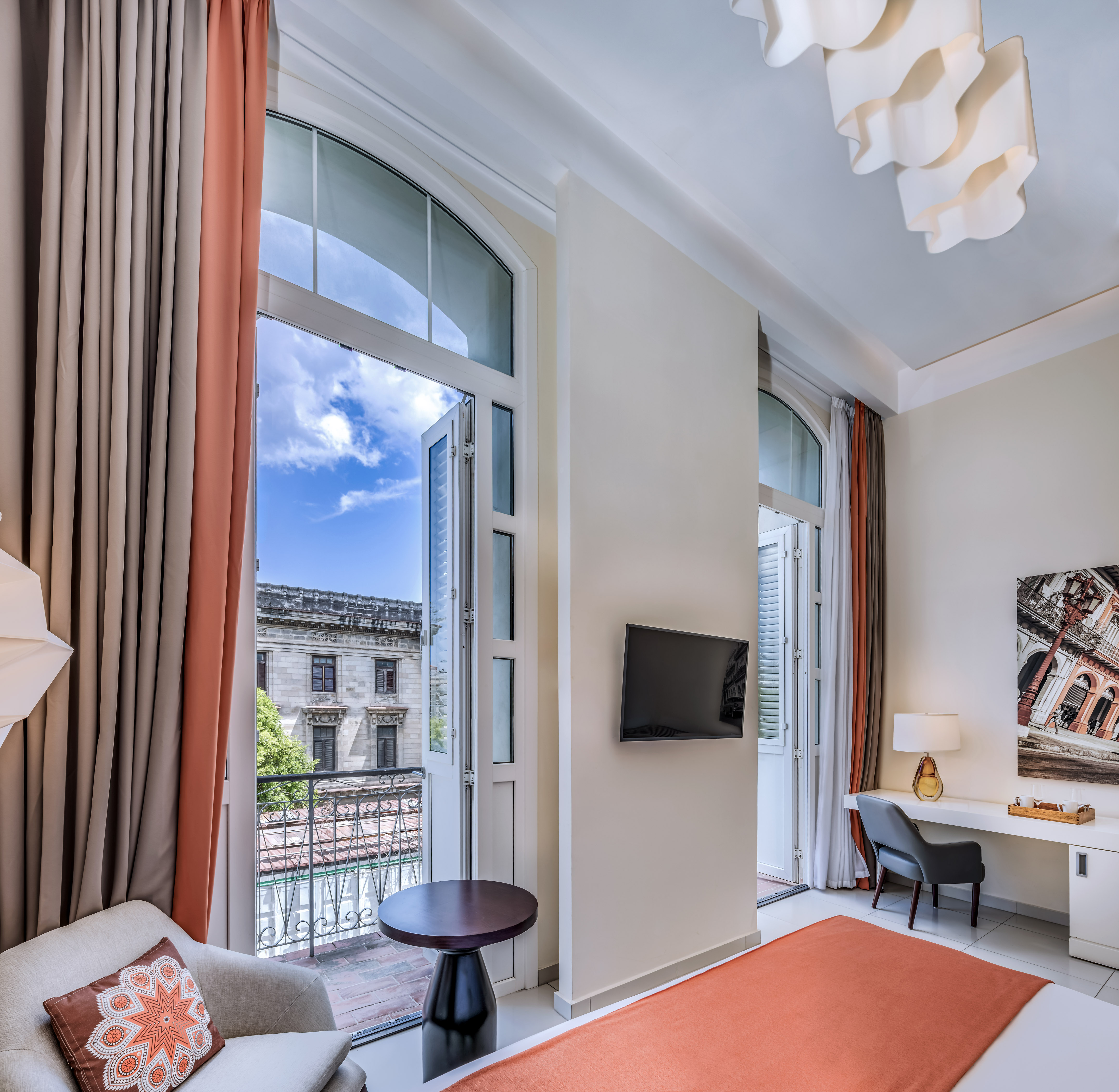 a room with a bed and a tv