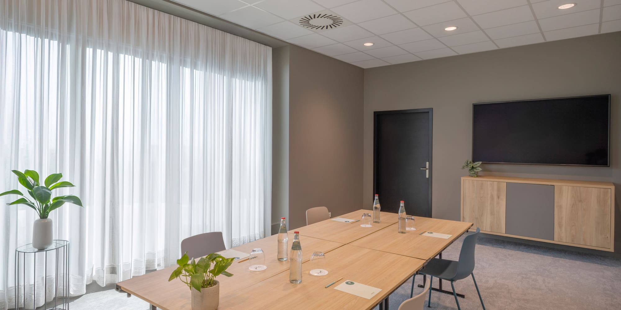 a room with a table and chairs