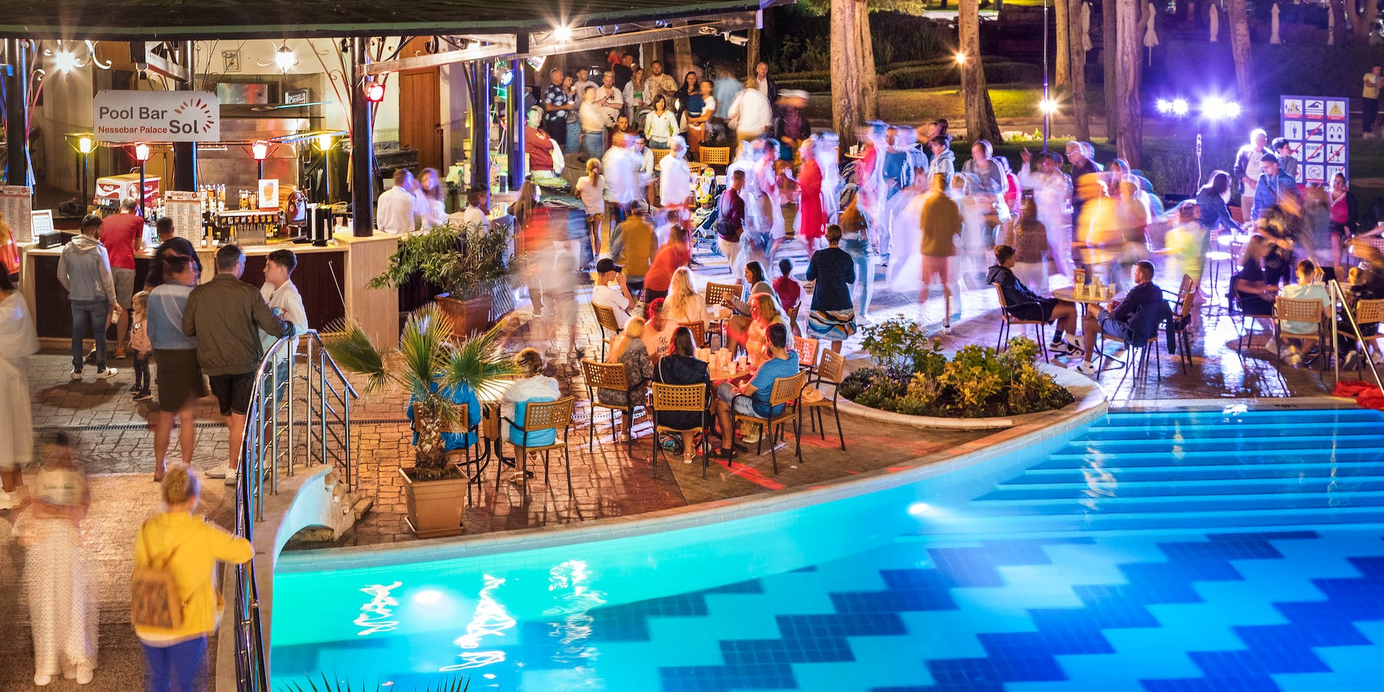 a group of people at a pool