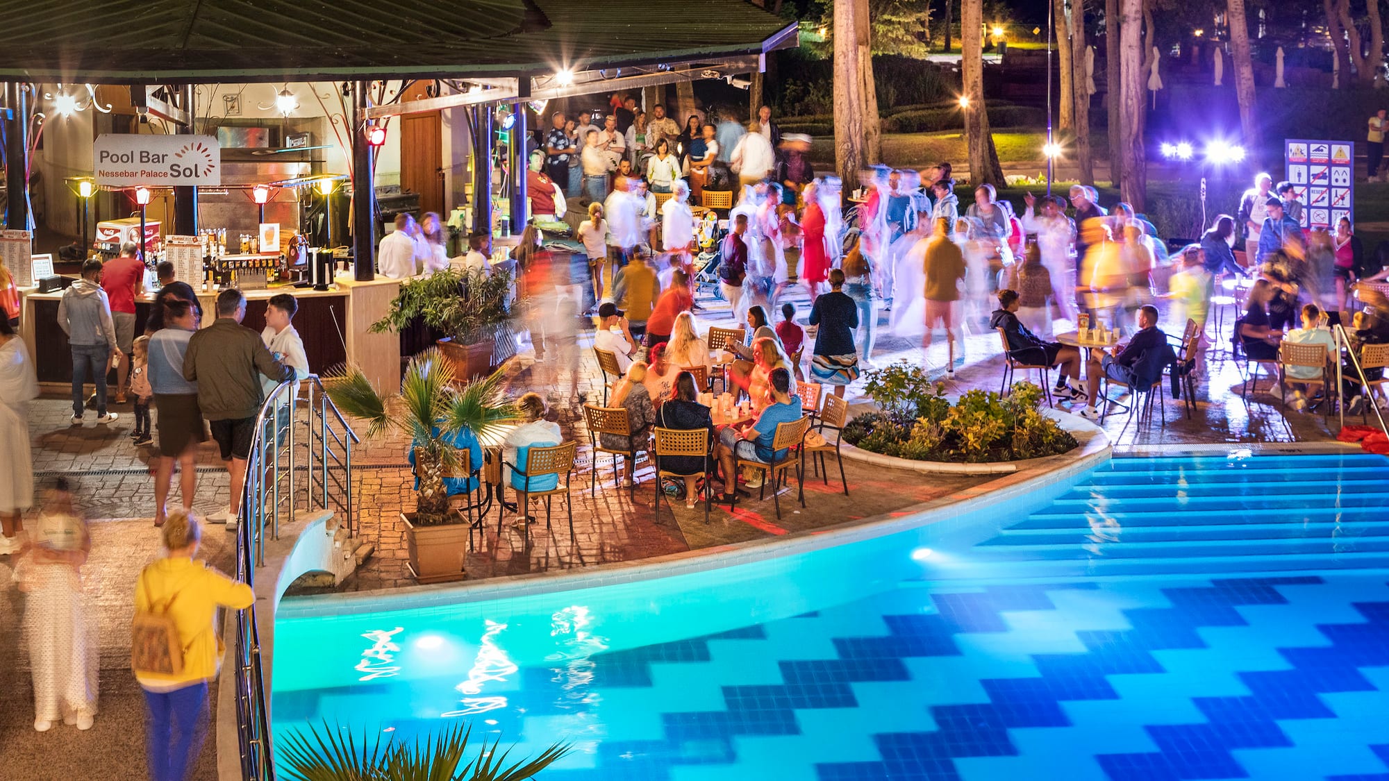 a group of people at a pool