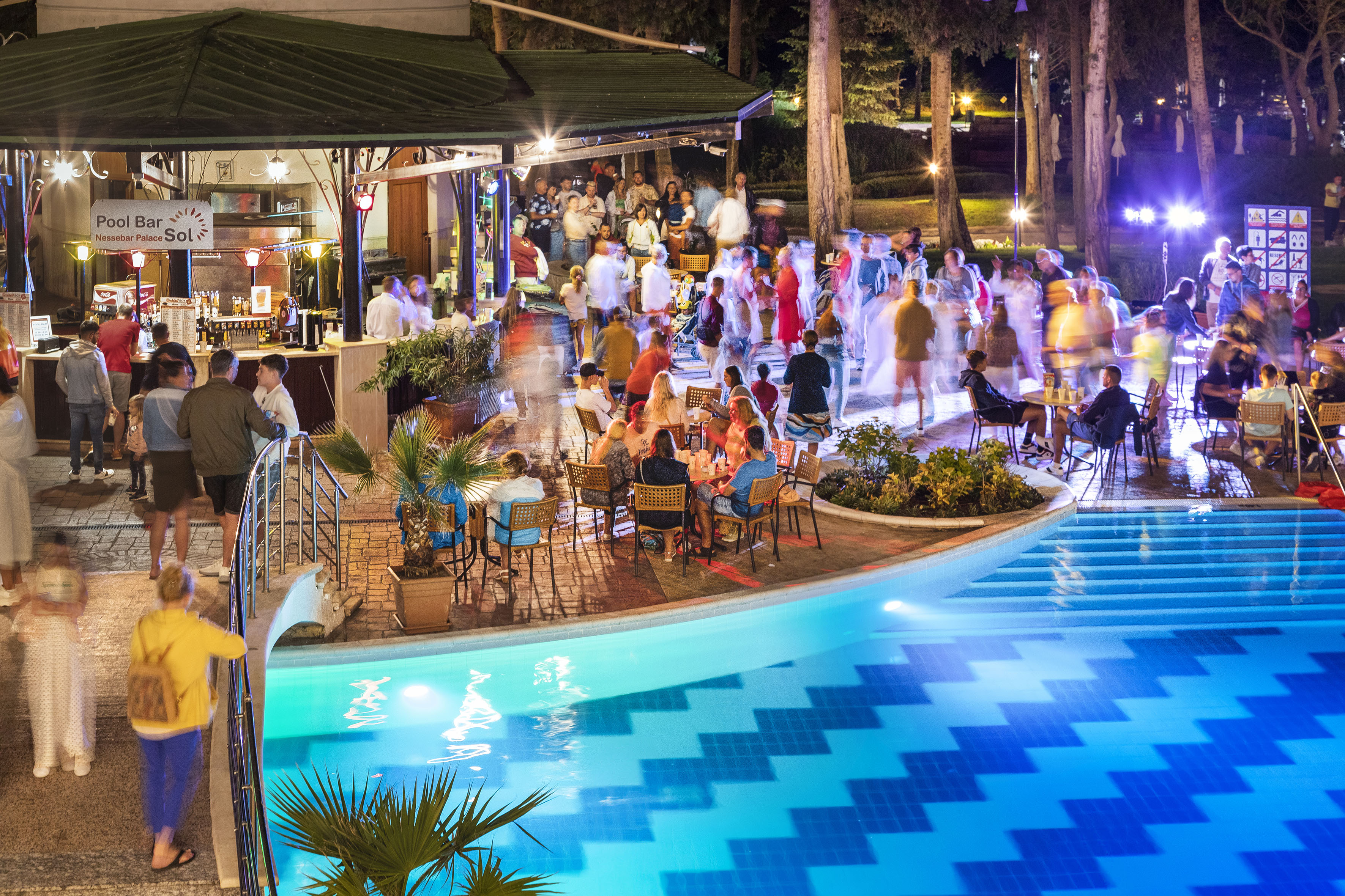 a group of people at a pool