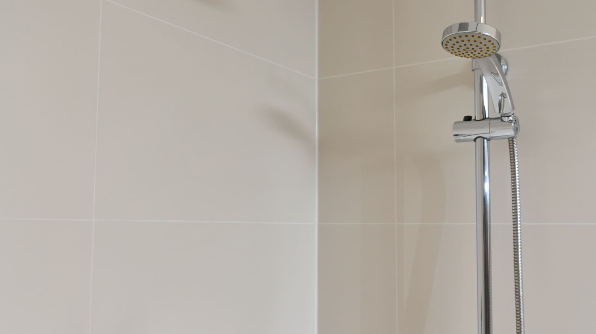 a shower head in a bathroom