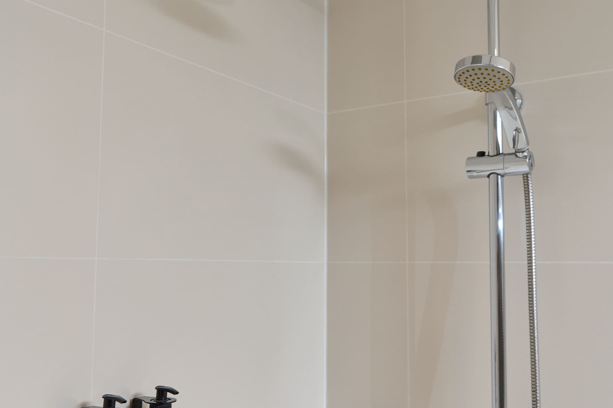 a shower head in a bathroom