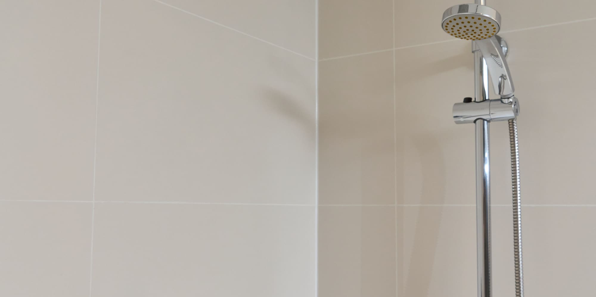 a shower head in a bathroom