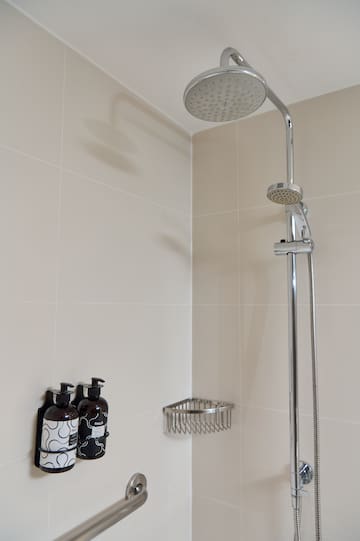 a shower head in a bathroom