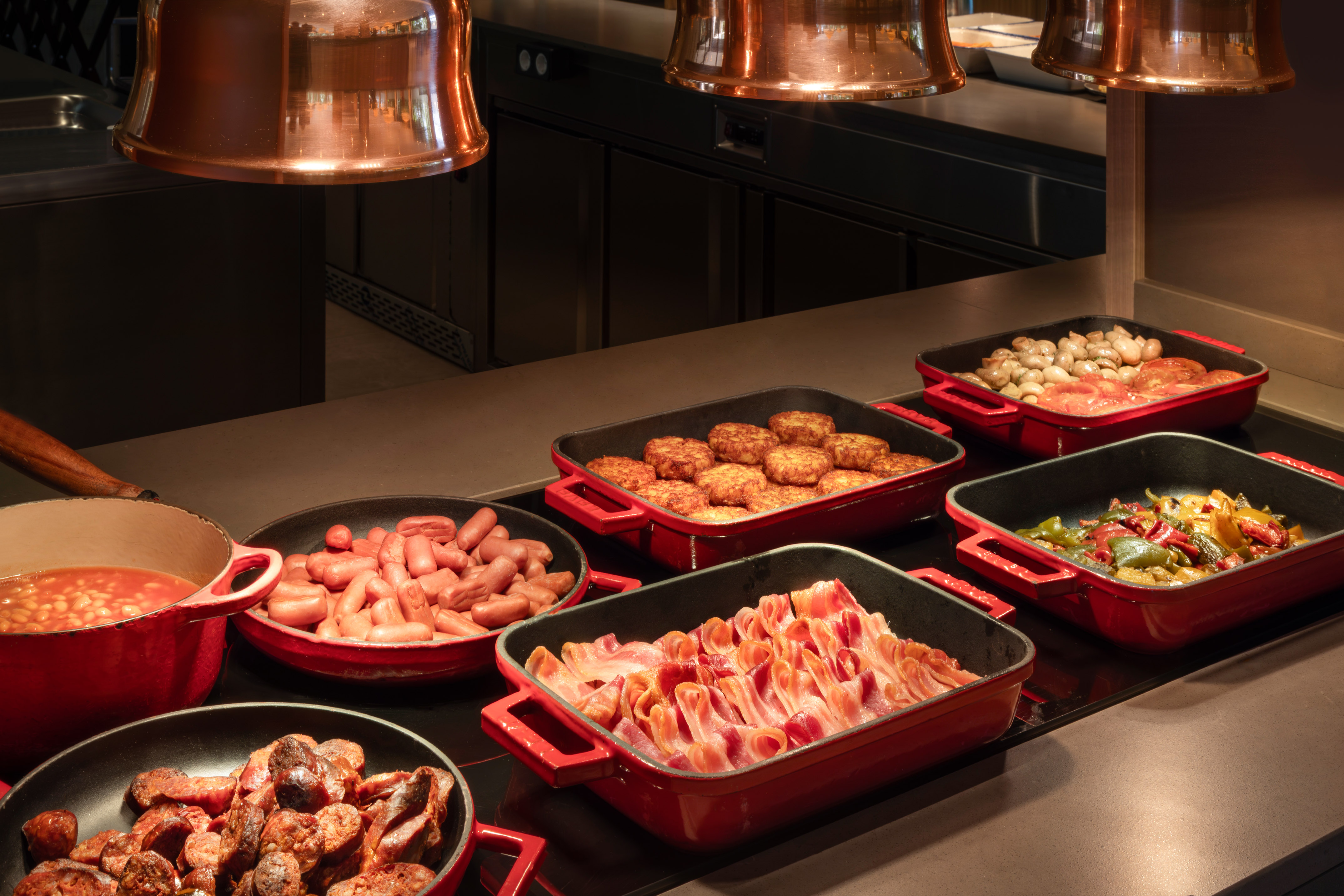 a group of pans with food in them