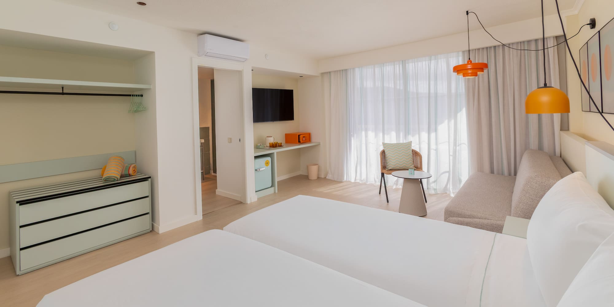 a room with two beds and a table