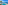 Tropical infinity pool overlooking blue ocean with palm tree.