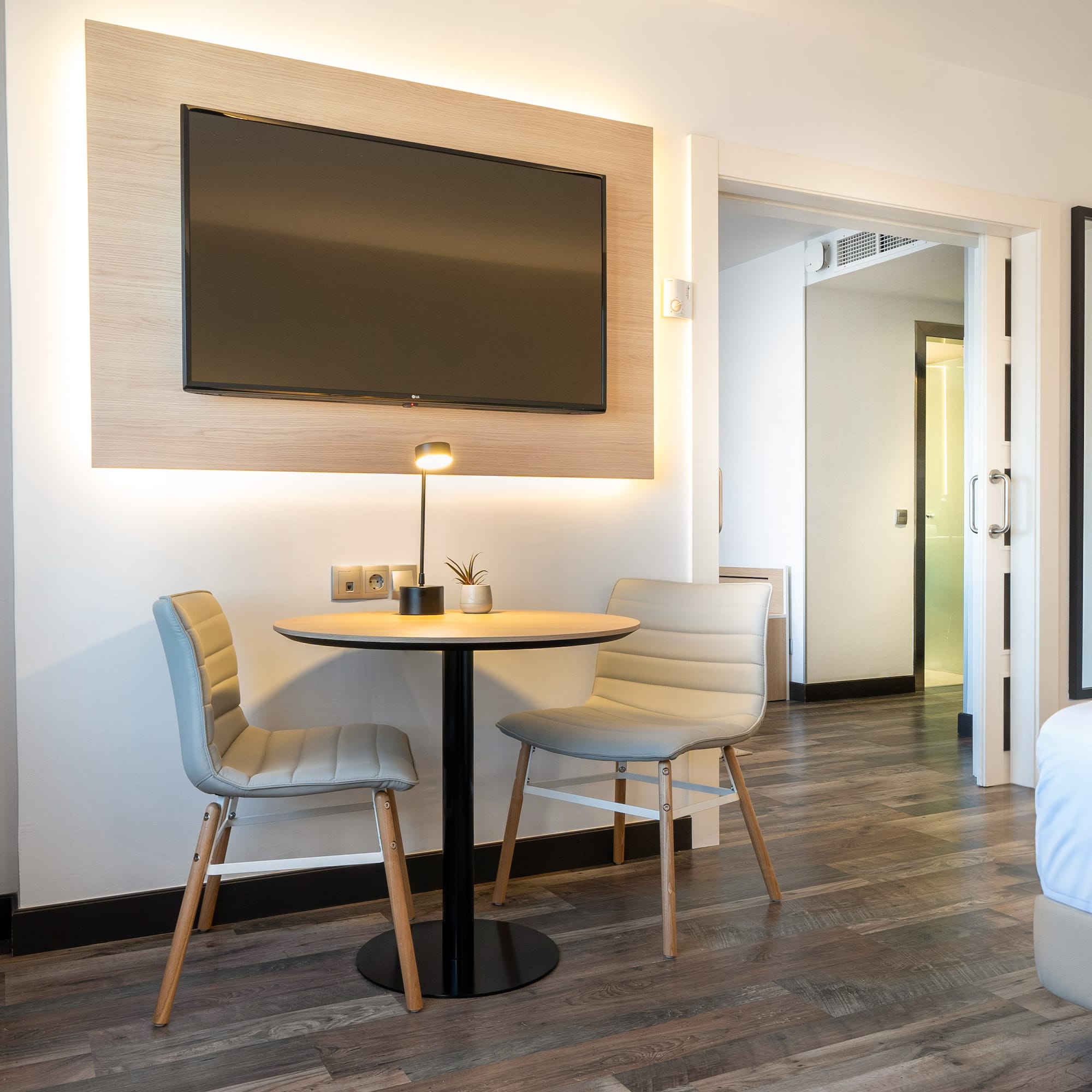 a room with a table and chairs