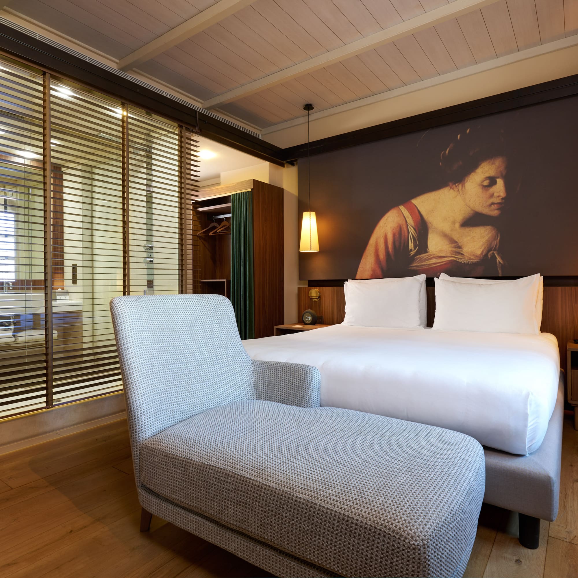 a bed and a chair in a room