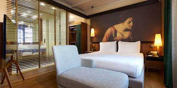 a bed and a chair in a room