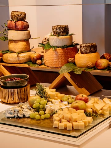 a table with different types of cheese on it