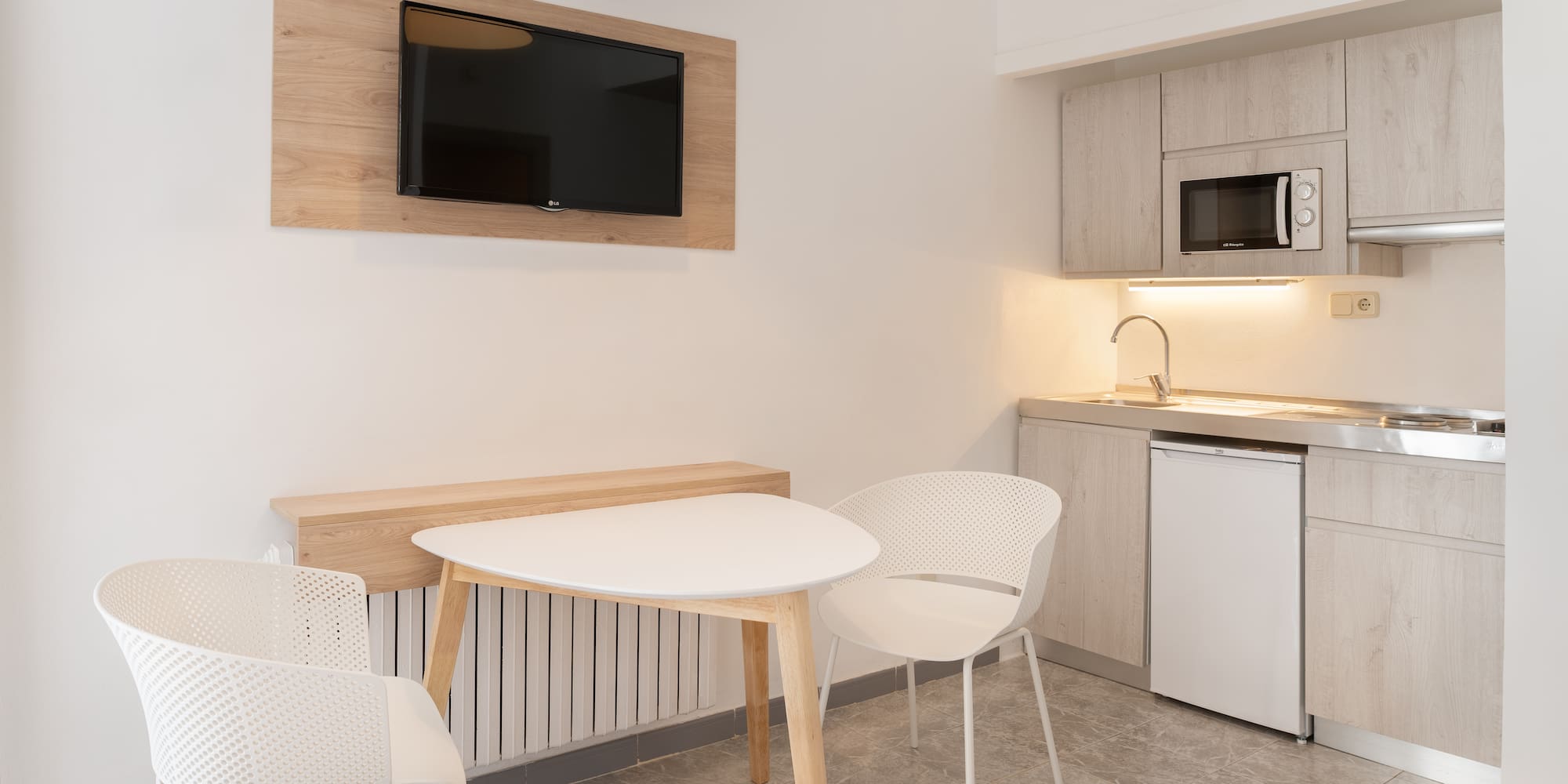 a room with a table and chairs