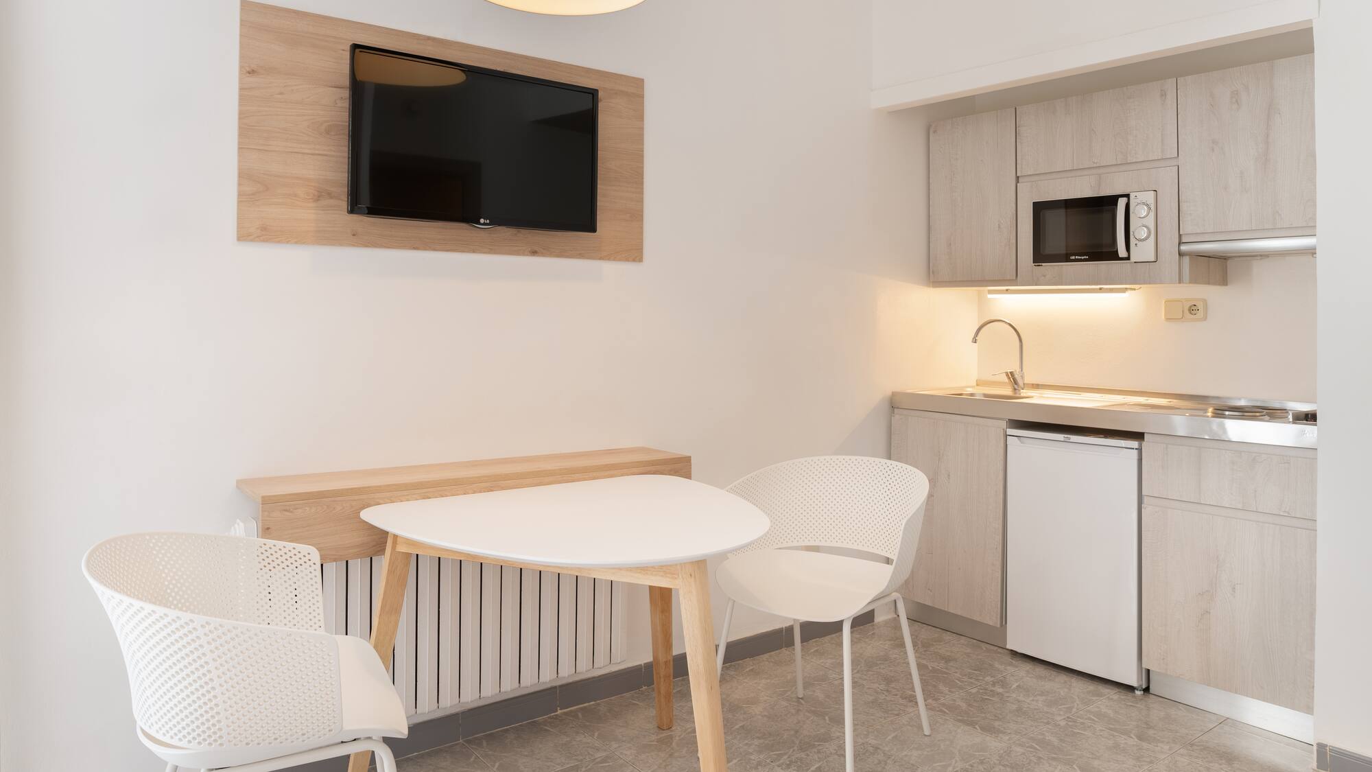 a room with a table and chairs