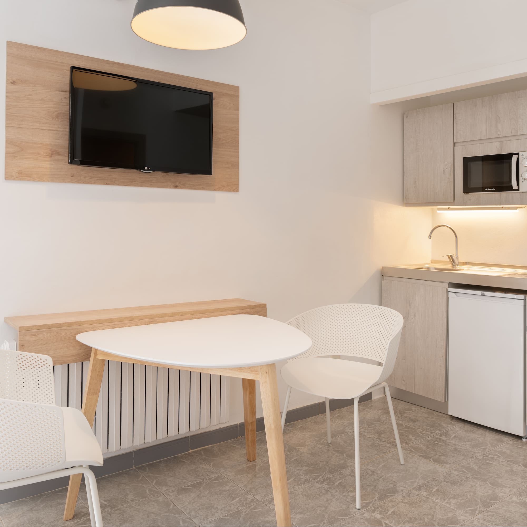 a room with a table and chairs