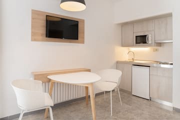 a room with a table and chairs