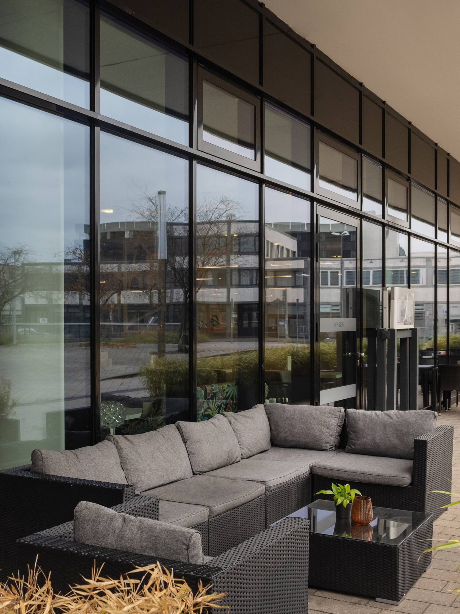 a couches and tables outside a building