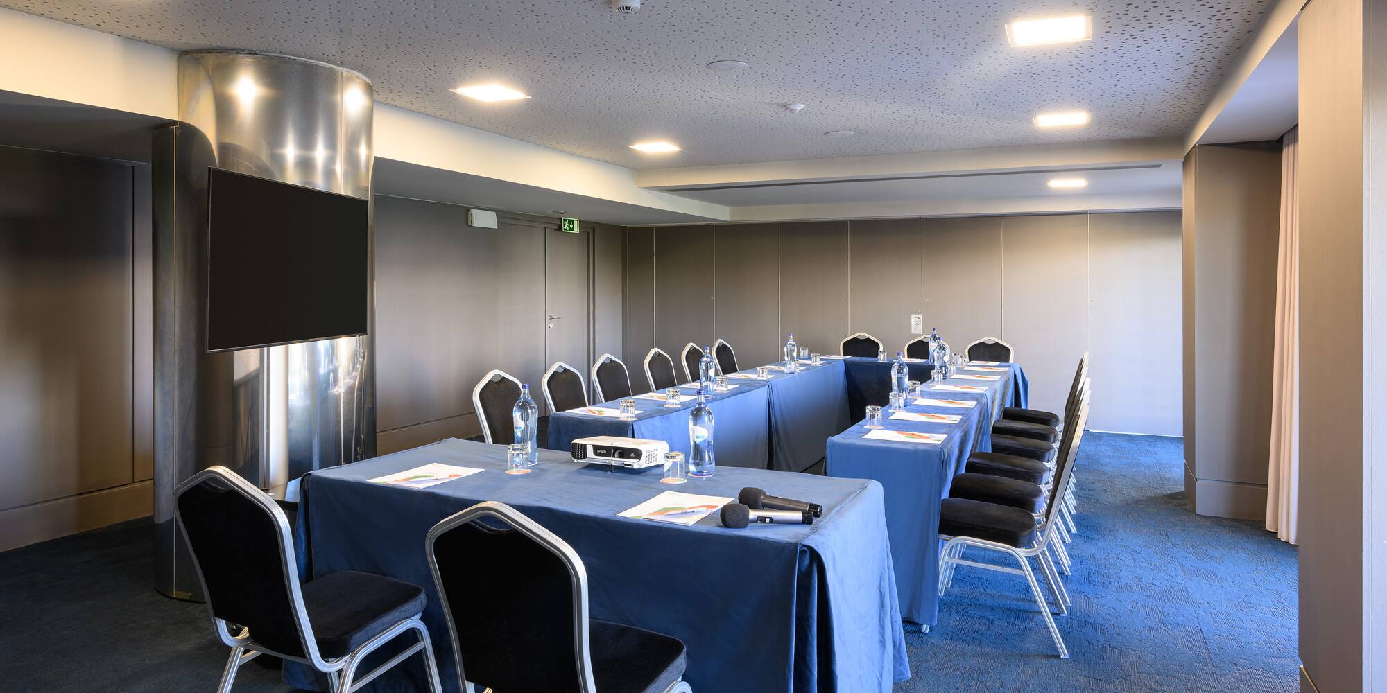 a room with a table and chairs