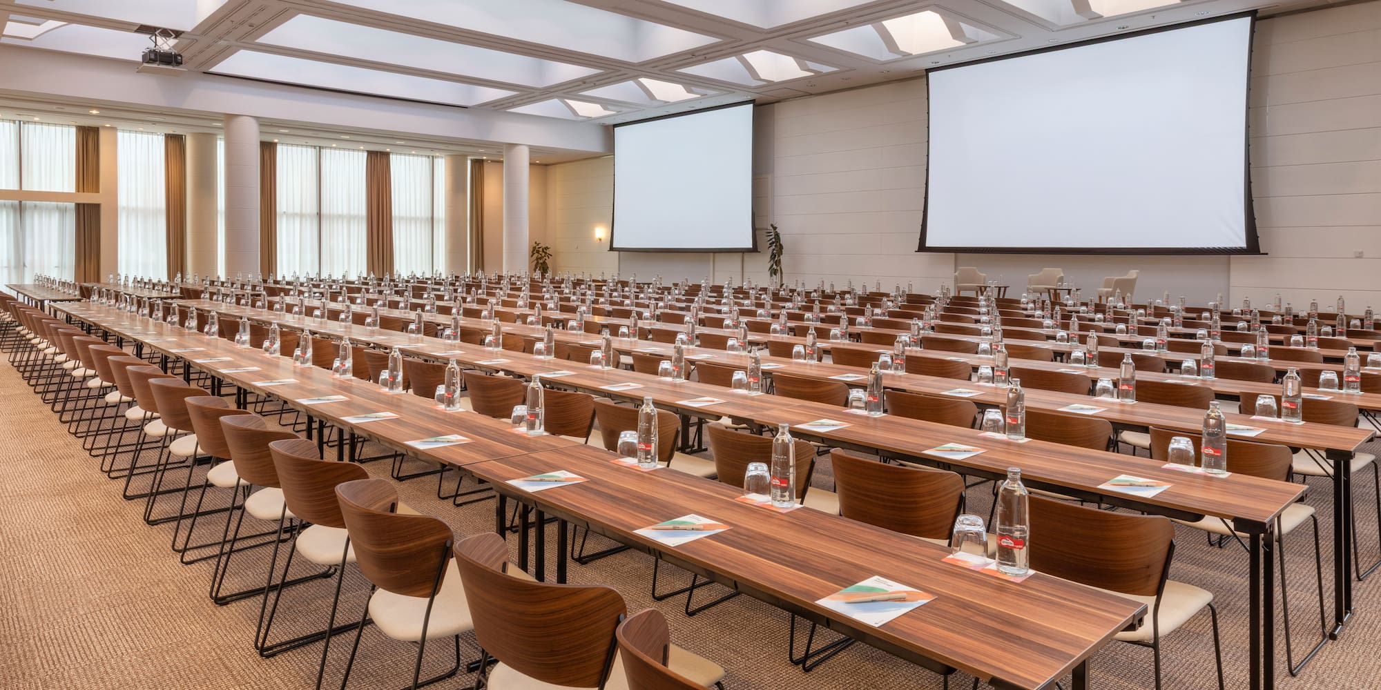 a large conference room with tables and chairs