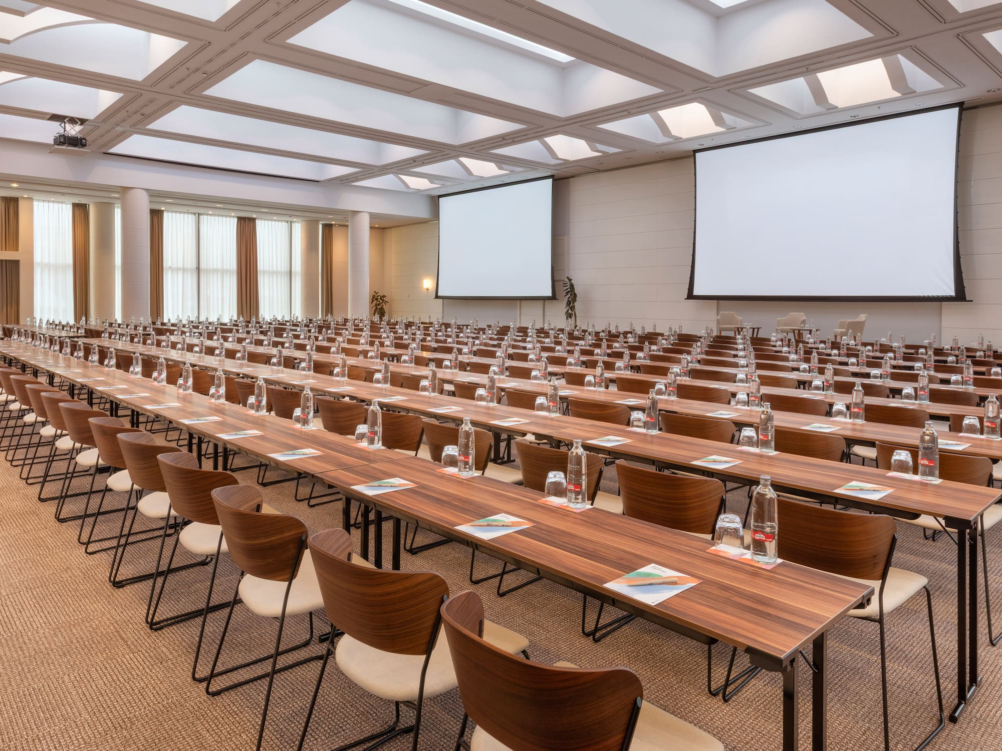 a large conference room with tables and chairs