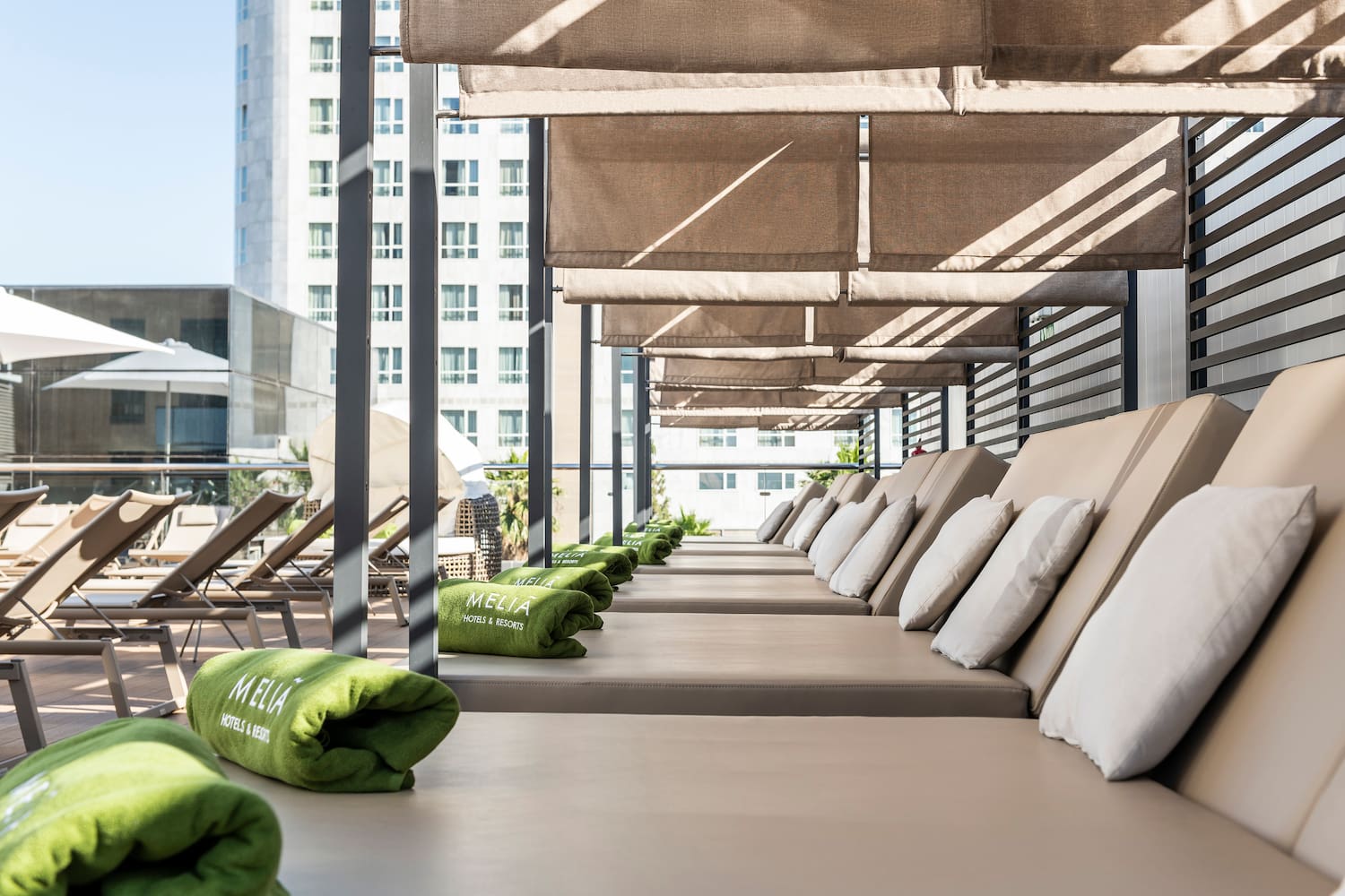a row of lounge chairs on a patio
