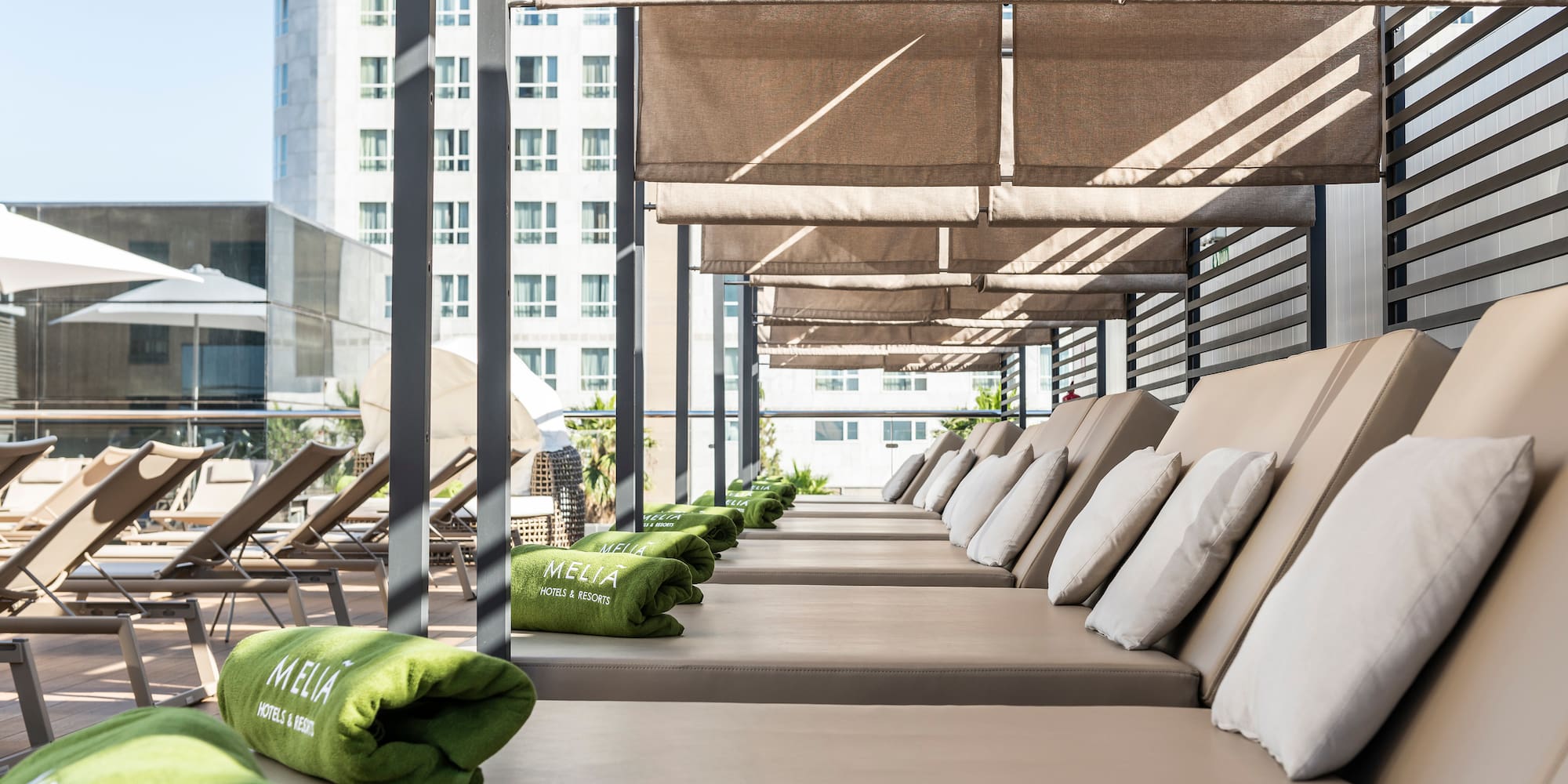 a row of lounge chairs on a patio