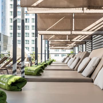 a row of lounge chairs on a patio