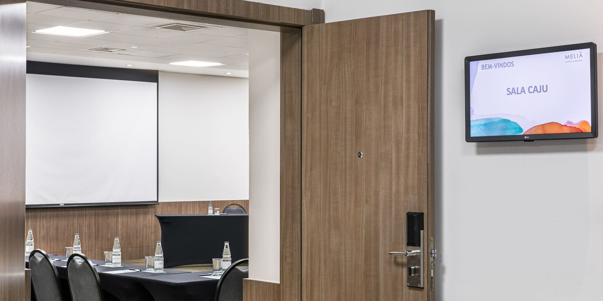 a door with a table and chairs in a room