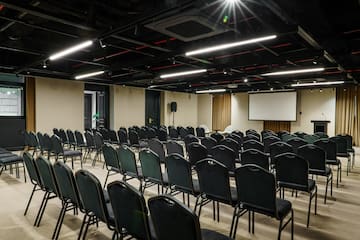 a room with rows of chairs
