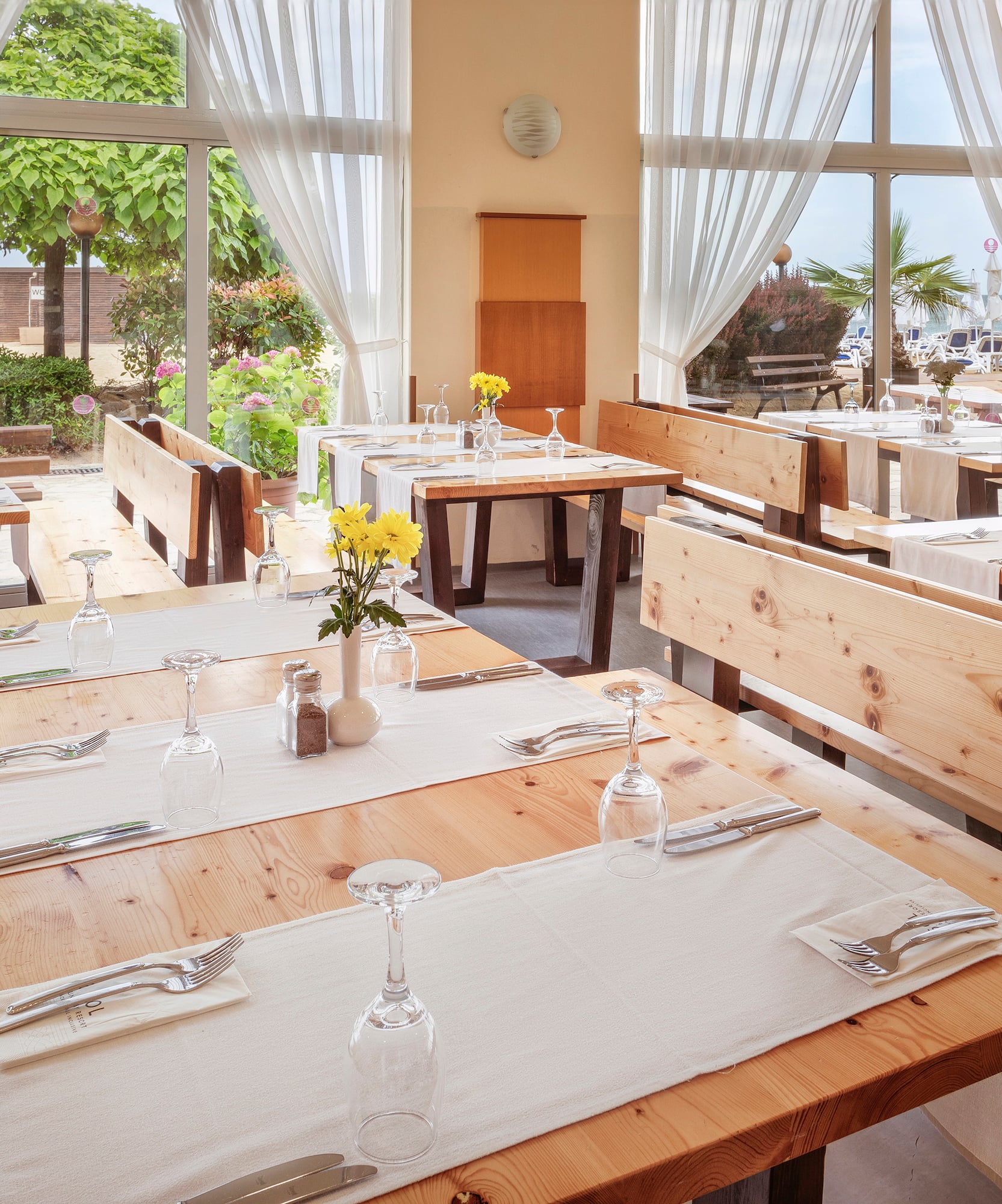 a restaurant with tables and chairs