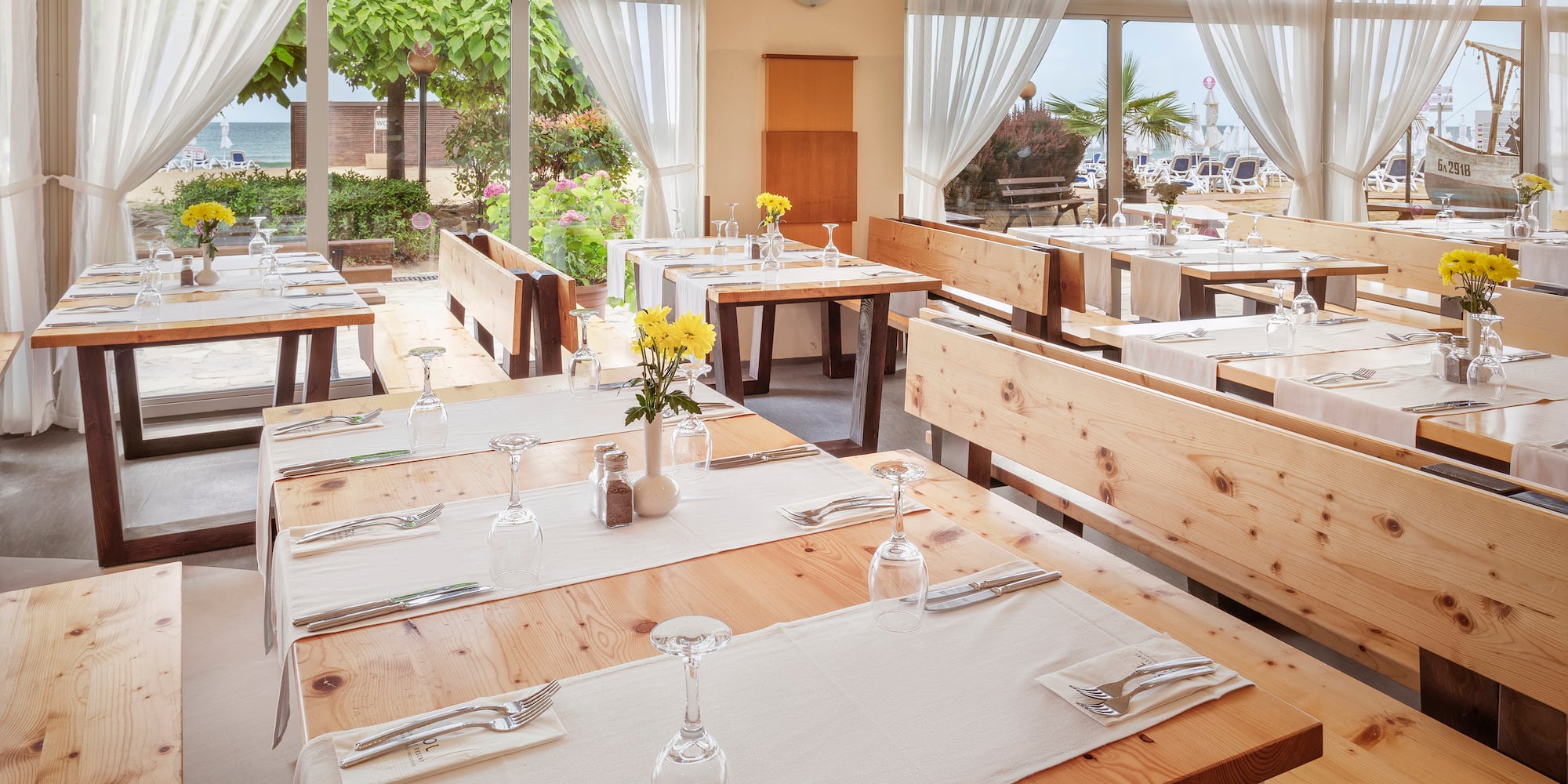 a restaurant with tables and chairs