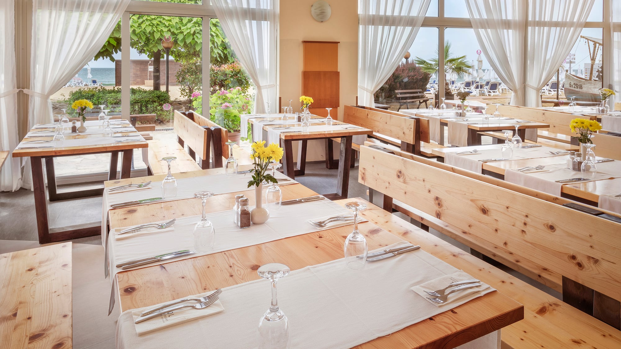 a restaurant with tables and chairs