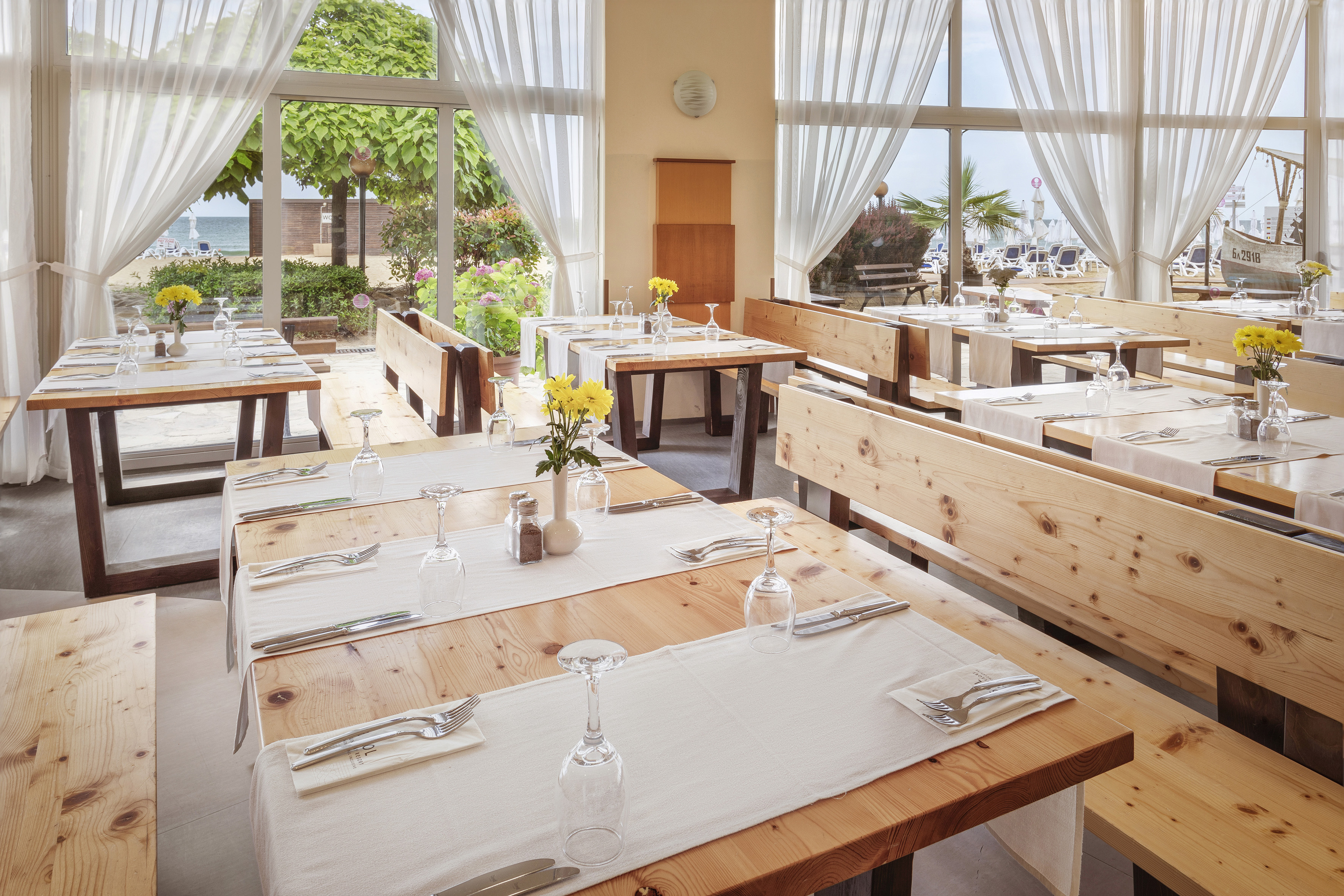 a restaurant with tables and chairs