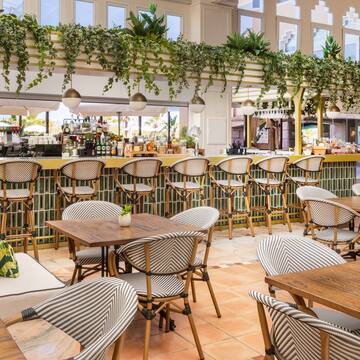 a restaurant with tables and chairs