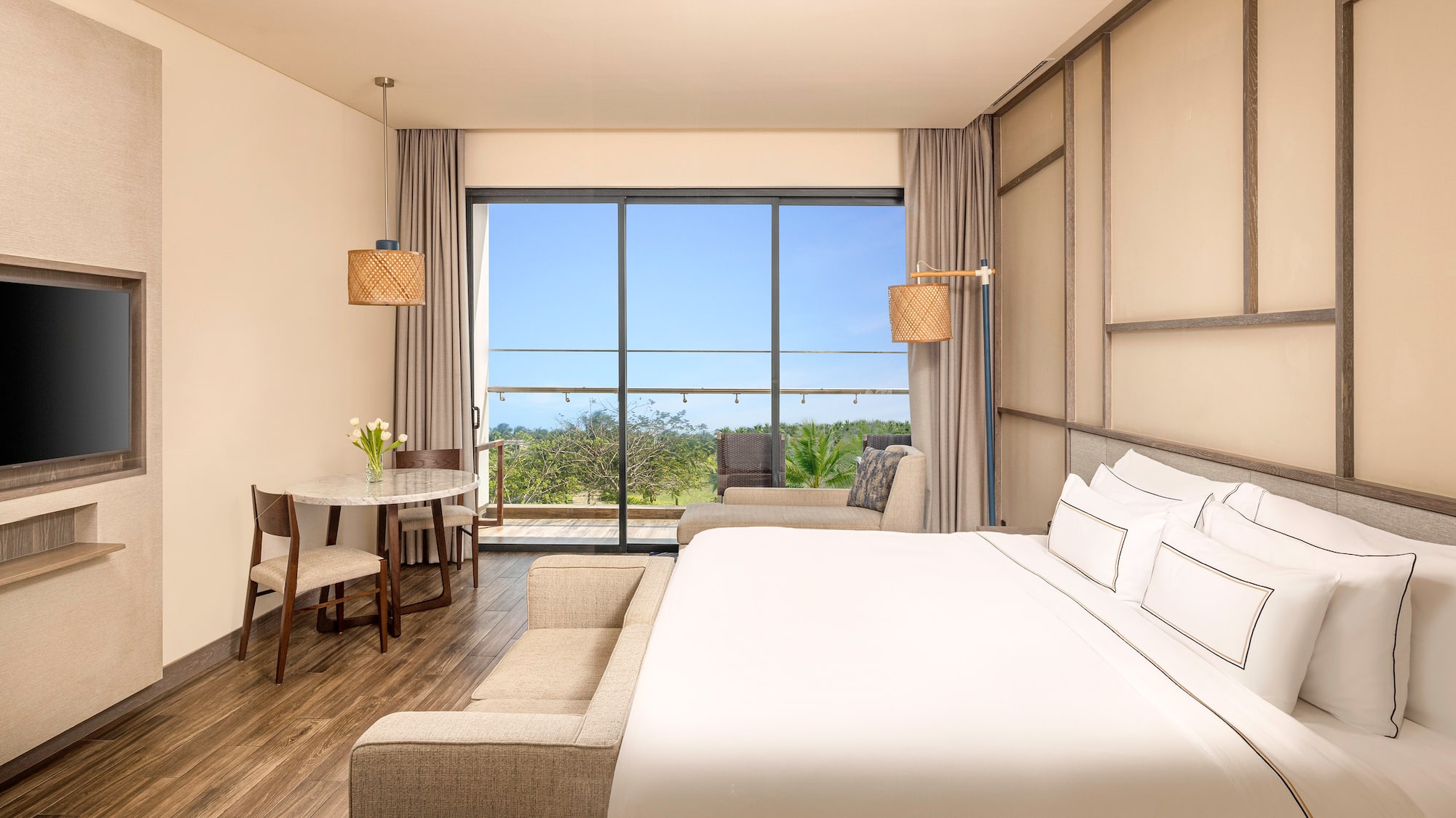 a room with a bed and a table and chairs